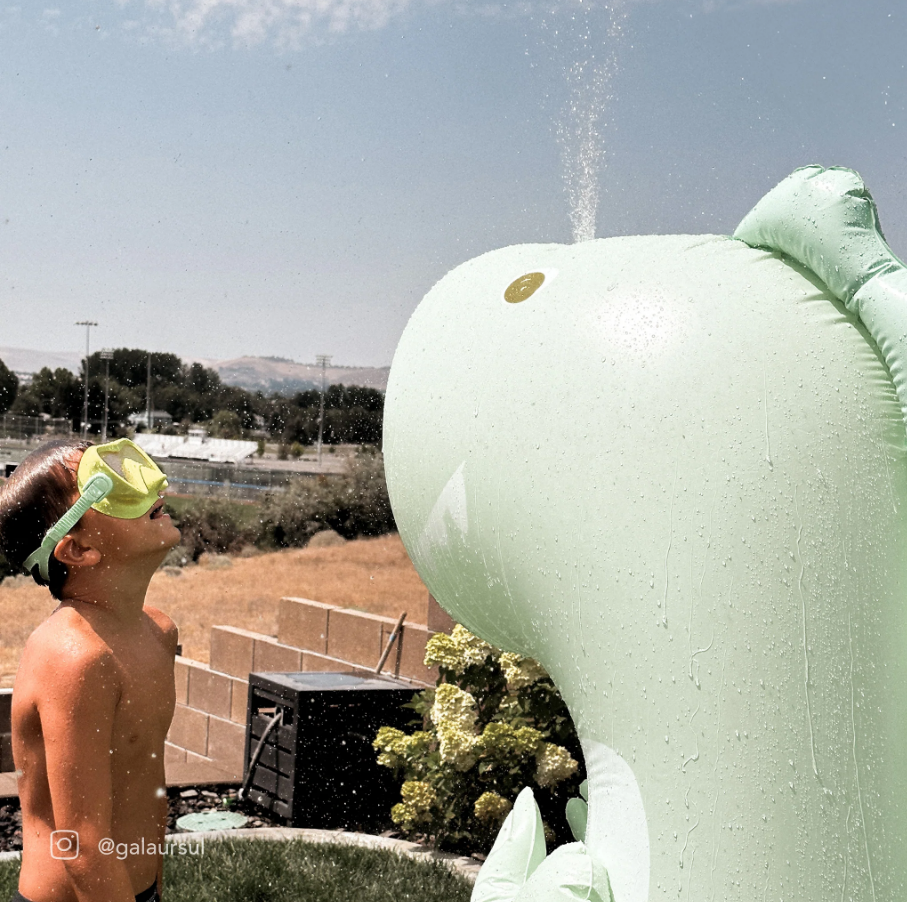 Inflatable Giant Sprinkler Surfing Dino - Ice Mint |  | Safari Ltd®